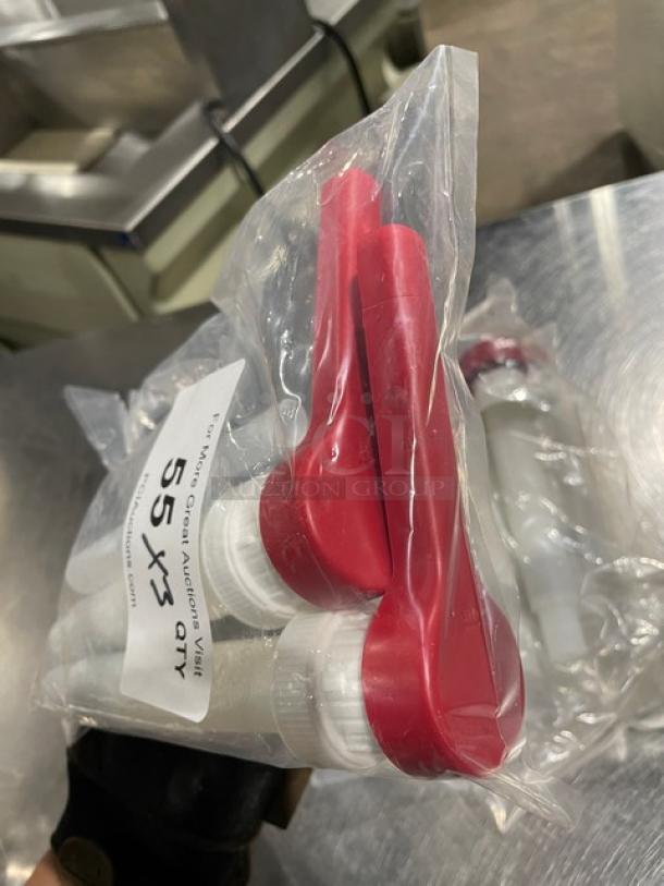 Brand new commercial red condiment pump set in packaging, labeled "55 Qty x3," with red nozzles and white bases.