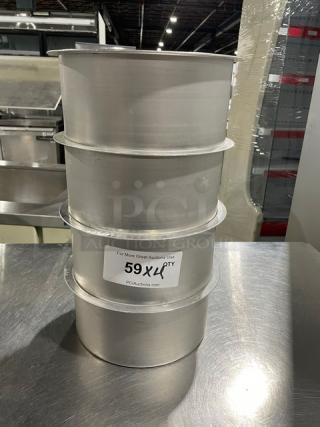 Lot of four commercial round stock pots, stacked. Includes visible label "59XLP Qty" from PCI Auctions.