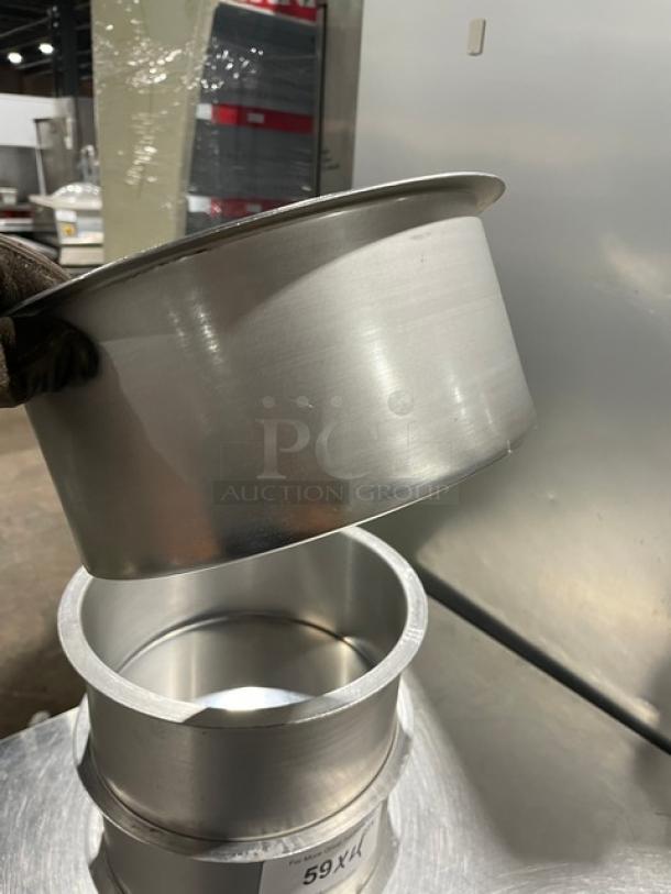 Commercial round stock pots, stainless steel, four-piece set, used, good condition, stackable design.