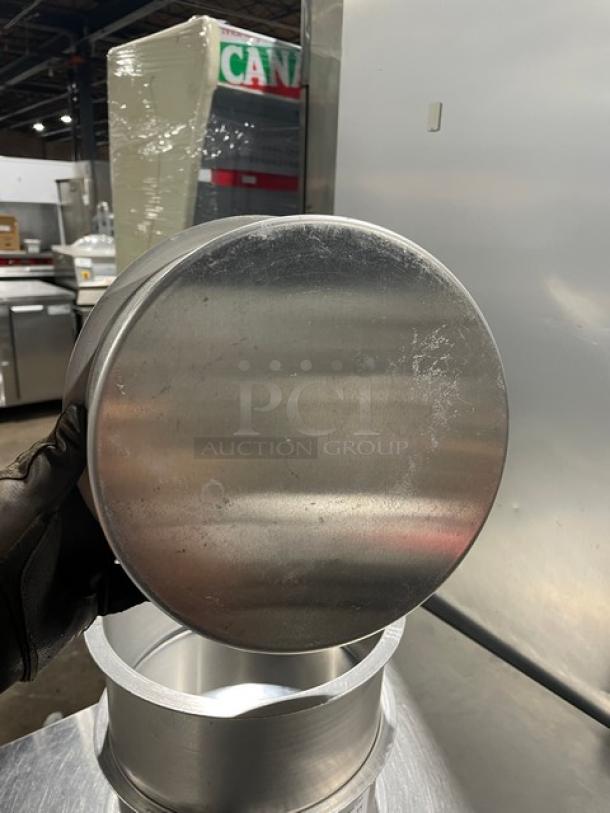 Commercial round stock pot, stainless steel, good condition, visible wear, part of lot of four, ideal for kitchens.
