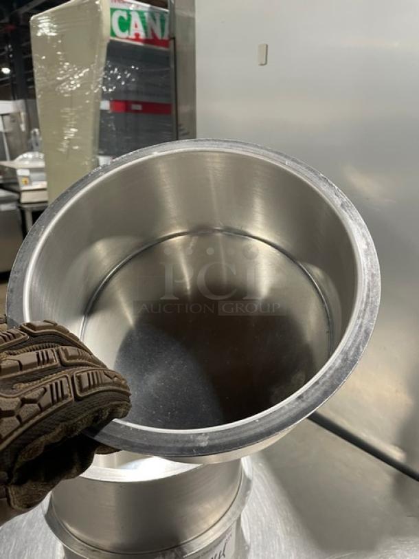 Lot of four commercial stainless steel round stock pots, excellent condition, shiny metal finish, durable quality.