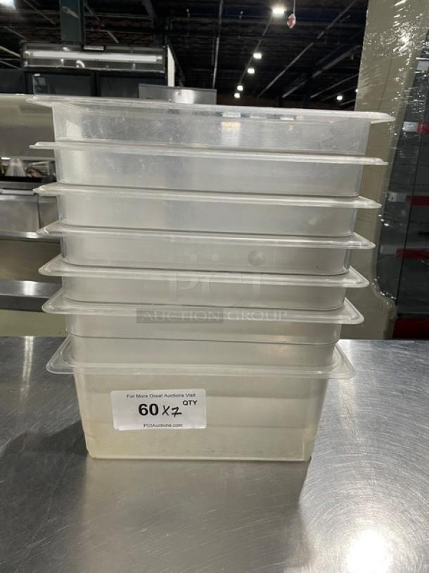Cambro commercial clear polycarbonate food pans, stack of seven. Label reads "60 X 7 QTY." Ideal for restaurant use.