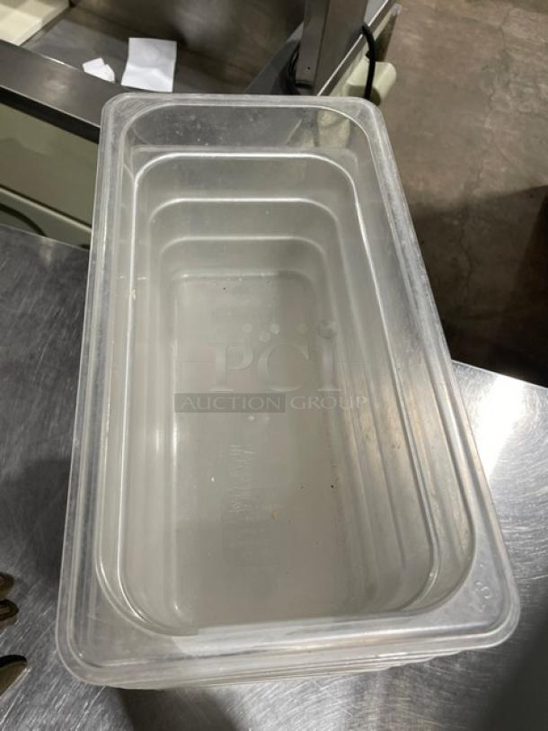 Cambro clear polycarbonate food pan, commercial grade, rectangular shape, minimal wear, stackable design.