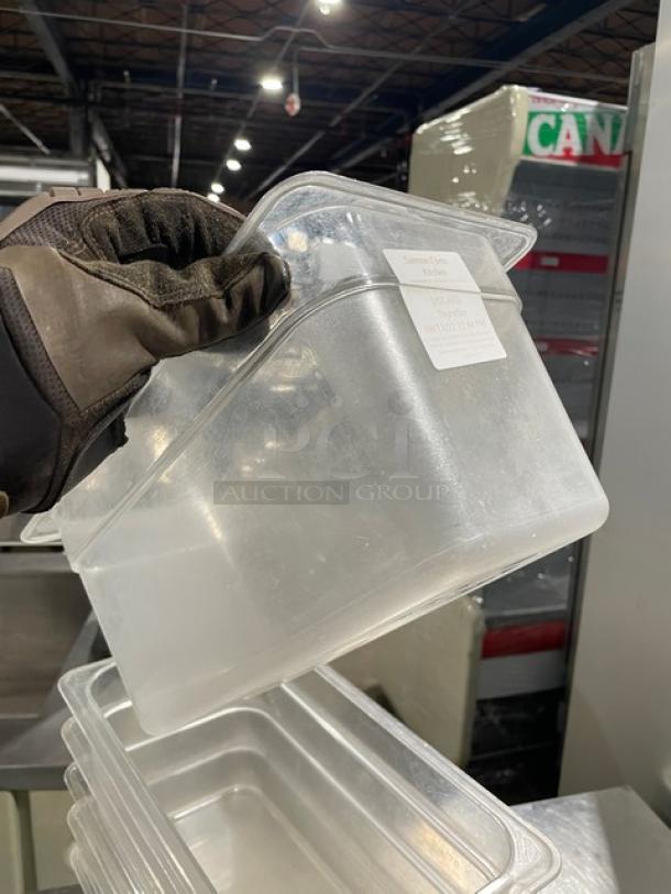 Cambro clear polycarbonate food pan, lightly used, visible label with measurements, durable commercial quality.