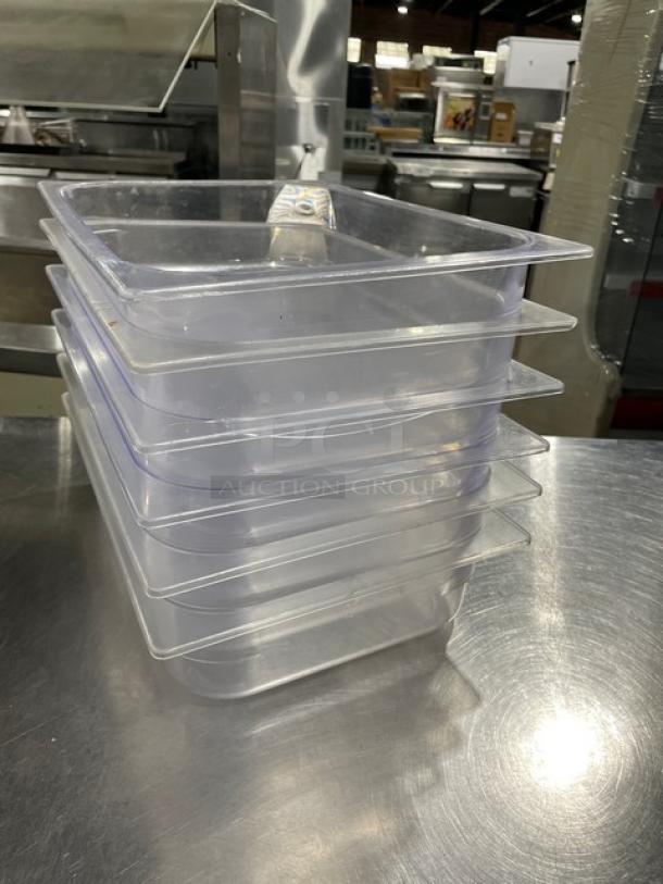 Clear polycarbonate food pans, stack of six, commercial-grade, transparent design, excellent condition, auction item.