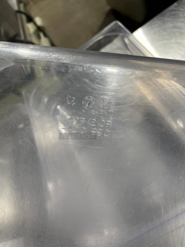 Clear polycarbonate food pan, commercial grade, heat resistant up to 210°F, marked with temperature range and recycling symbols.
