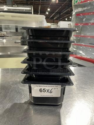 Vollrath Commercial Black Food Pan set of six, stacked, used condition, model number and details not visible. Quantity tag shows 65X6.