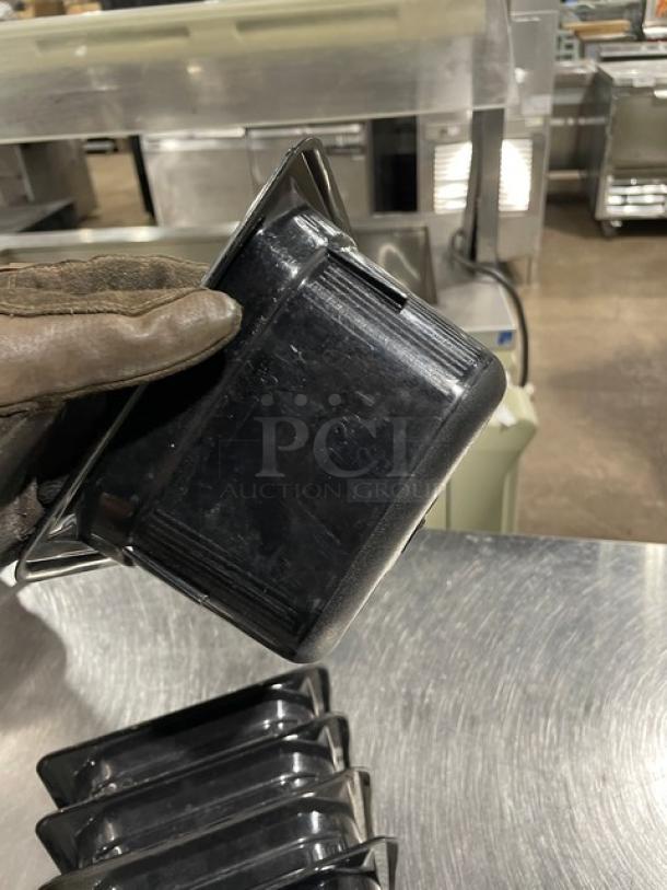 Vollrath commercial black food pan, durable plastic, used condition, features stackable design, kitchen use.