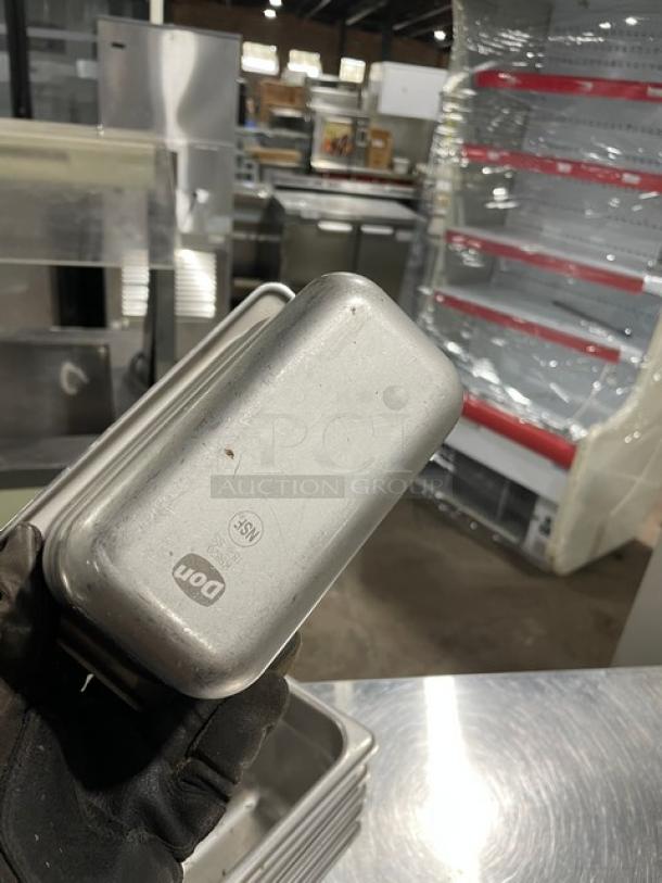 Don commercial stainless steel steamtable pan, new condition, embossed with "Don" logo and NSF certification.