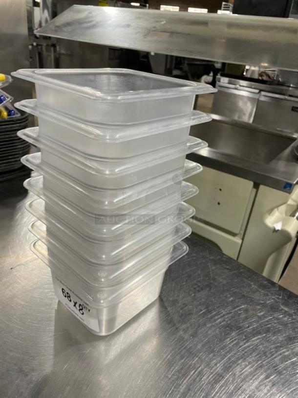 Vigor commercial clear polycarbonate food pans, stacked, new condition, 8x quantity. Marking: "68 X 8" visible.