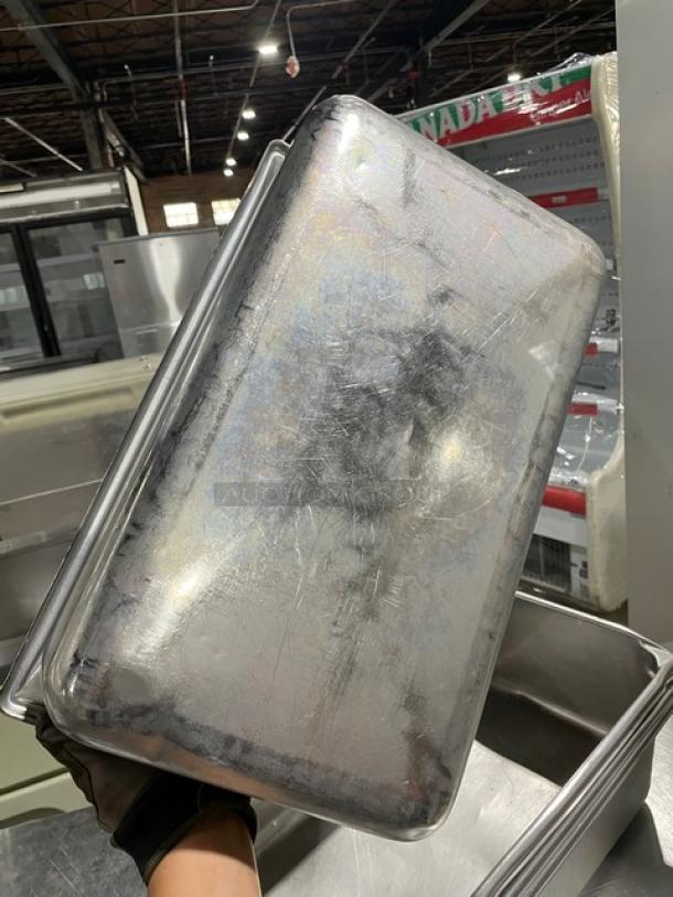 Commercial stainless steel hotel pan, durable, used, some scratches, ideal for steam table; multiply bid by four.