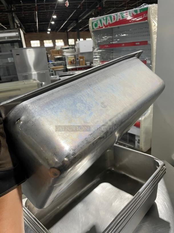 Commercial stainless steel hotel steamtable pan, used, durable, rectangular shape, suitable for catering or restaurant use.