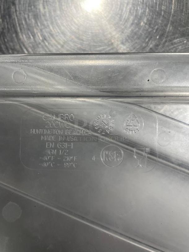 Clear Cambro food pan lid, polycarbonate; marked with NSF and recycling symbols, made in USA, model EN 631-1.