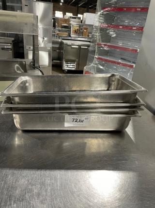 Commercial stainless steel hotel steamtable pan, stack of 4, in used condition. Visible label: "72X4 Qty."
