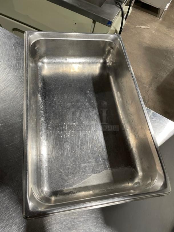 Commercial stainless steel steamtable pan, rectangular shape, used condition, suitable for hotel or catering use.