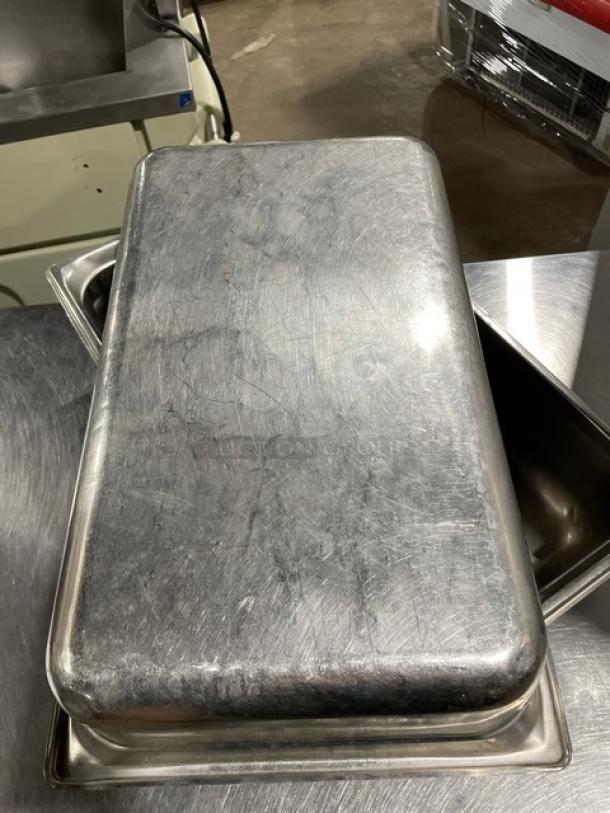 Stainless steel hotel steamtable pan, rectangular, used condition, showing scratches and wear consistent with commercial use.