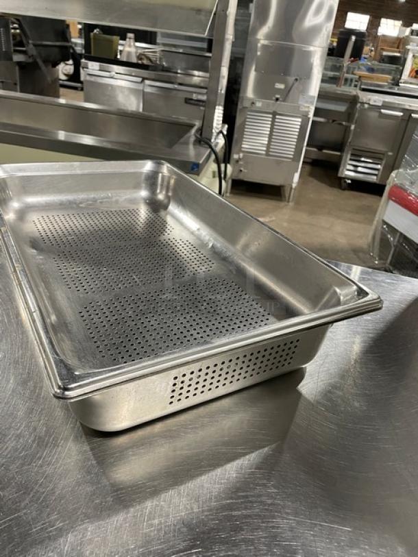 Commercial stainless steel perforated hotel/steamtable pan, excellent condition, ideal for catering and food service.