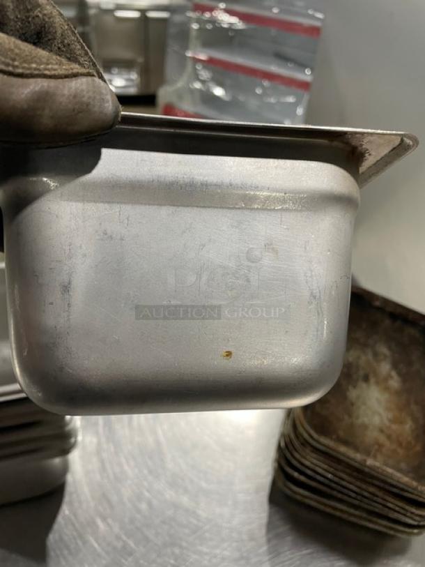 Commercial stainless steel hotel/steamtable pan, slightly used, durable, stackable, 7-inch size, ideal for catering.
