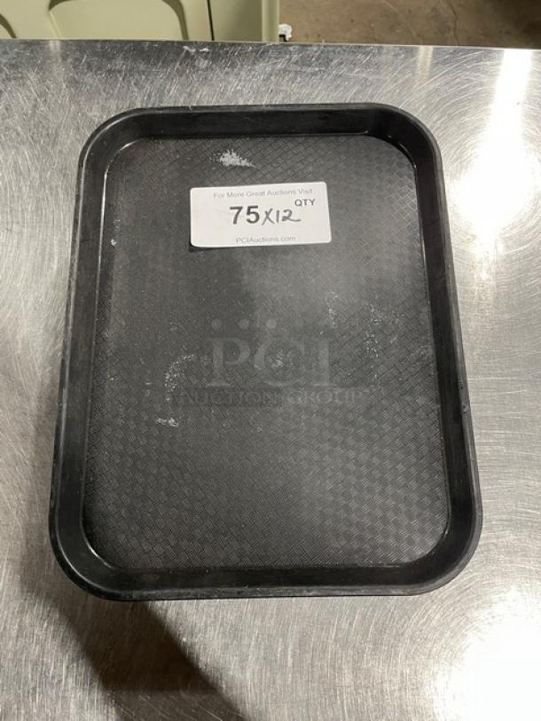 Cambro commercial black serving tray, slightly used, textured surface; 12 included per bid. Label states "75QTY x12".