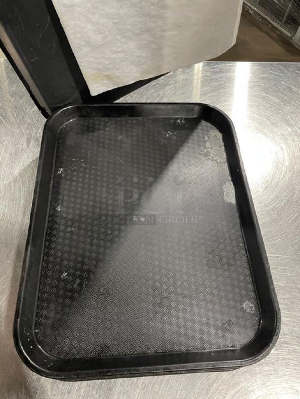 Cambro commercial black serving tray, 12x17 inches. Used condition with slight wear. Textured surface for grip.