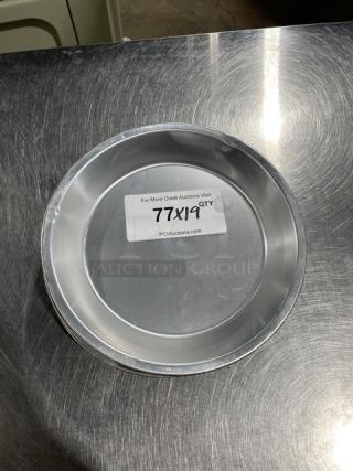 Commercial round pie pan, aluminum, pristine condition, labeled "77X19 QTY" from PClAuctions.com.