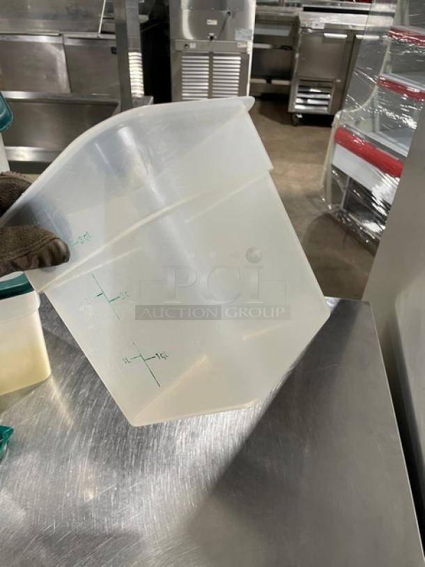 Translucent 3.5 Qt food storage container with lid, new condition, marked measurements, durable plastic.