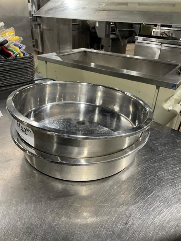 Commercial stainless steel round stacking baking pans, set of two, in used condition, with visible shiny finish.