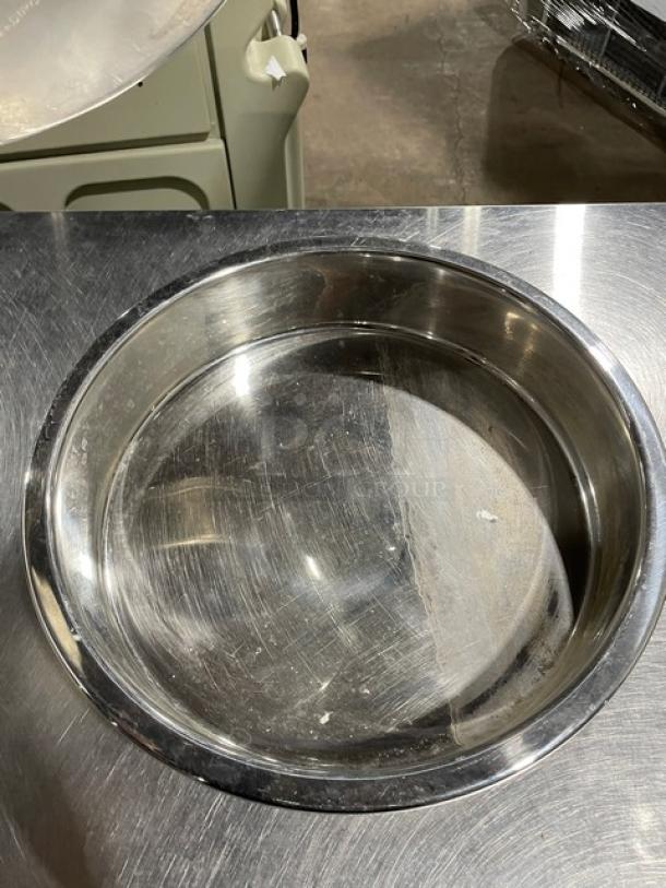 Commercial stainless steel round stacking/baking pan, scratched surface, durable and versatile kitchenware.