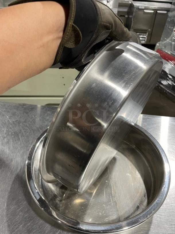 Commercial stainless steel round stacking/baking pan in excellent condition, shiny finish, durable, versatile kitchen use.