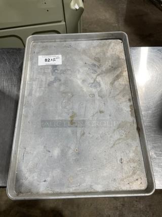 Commercial rectangular baking sheet pan, used condition, metal, dimensions approx. 7x bid amount indicated by label "82X".