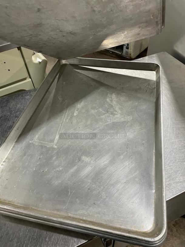 Commercial rectangular baking sheet pan, metal, used condition with visible wear. Dimensions: 7x bidding quantity.