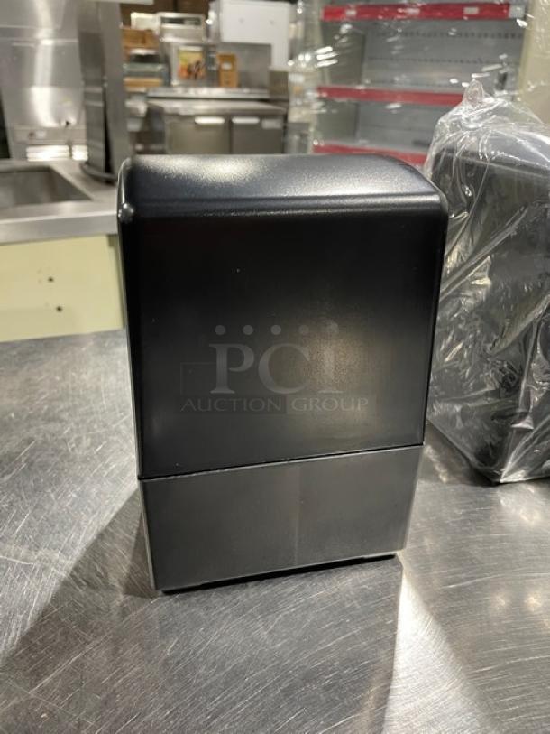 NEW Jofel black tabletop tall-fold napkin dispenser with legs, in excellent condition, ideal for commercial use.