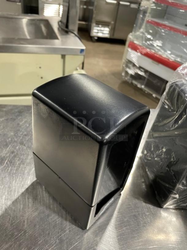 NEW Jofel commercial black tabletop napkin dispenser with tall-fold design on legs. Excellent condition, sleek design.
