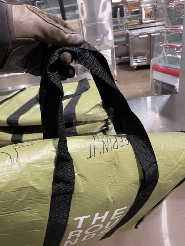 New green insulated fast food delivery bag, commercial grade, with black handles. Durable material, perfect condition.