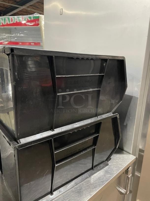 Stackable black countertop condiment bin, ideal for organizing utensils. Includes "ULINE S-17444" marking. Good condition.