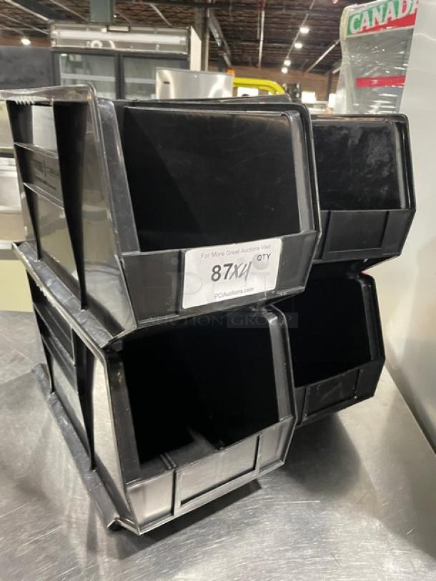 Commercial black stackable condiment/utensil bin set. Durable plastic, countertop use, excellent condition. Label: "87X4".