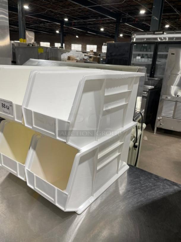 White stackable countertop condiment and utensil organizing bins in good condition, perfect for commercial use.