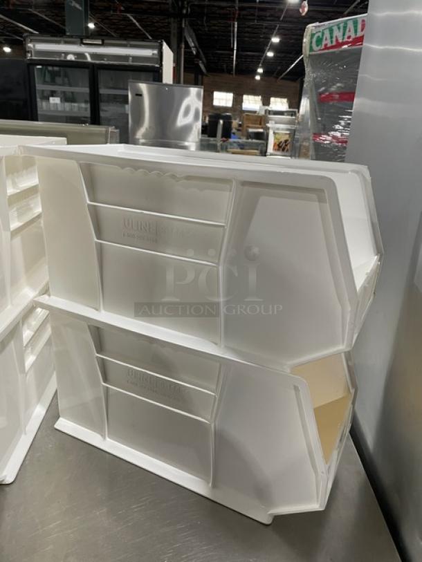 Commercial white stackable countertop organizing bins for condiments and utensils. Features durable plastic and easy stacking.