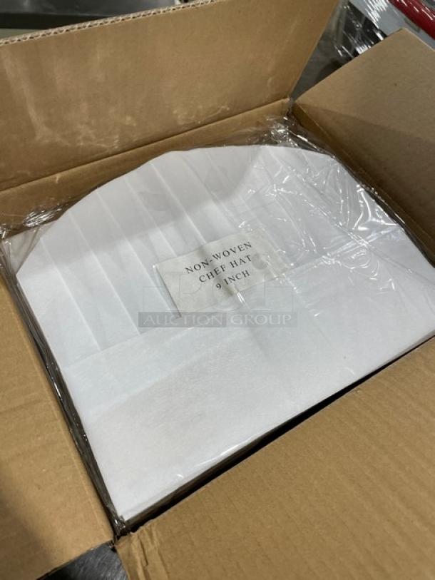 Brand new Landau Uniforms 10" round chef hats, model CW1475, packed in a box. 100 per case, non-woven material.