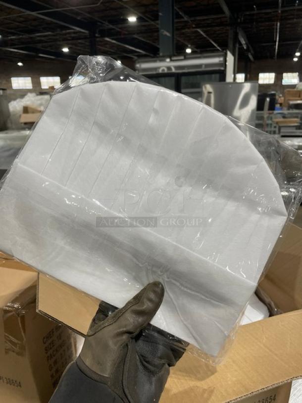 Brand new Landau CW1475 white non-woven 10" chef hat, 100 per case, shown in packaging in warehouse setting.