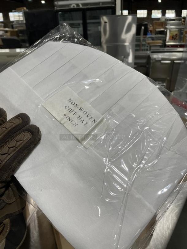Landau Uniforms white non-woven 10" round chef hat, model CW1475. Brand new, 100 per case, sealed packaging.
