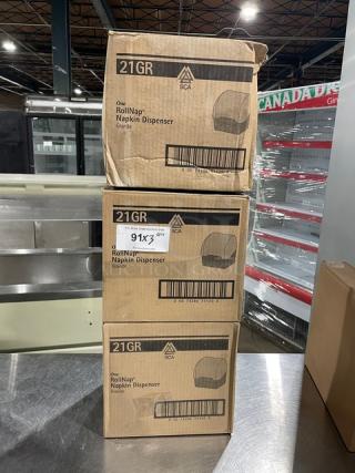 SCA Model 21GR granite napkin dispensers in boxes, brand new. Three stacked boxes. Labels show model and barcode.