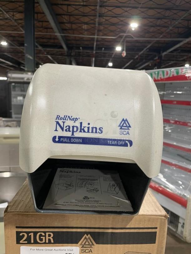 Brand new SCA Granite One RollNap napkin dispenser, model 21GR. Features pull-down, tear-off design.