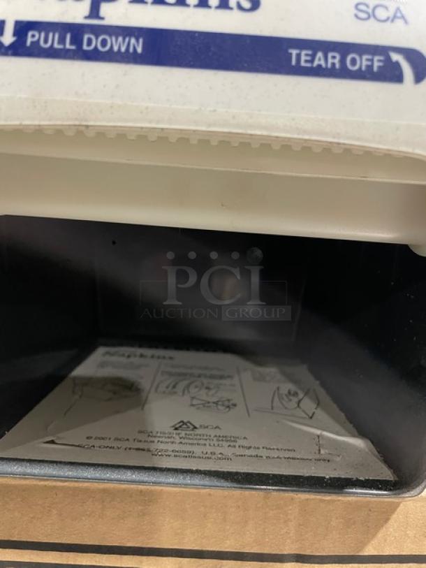Brand new SCA Commercial 21GR Granite Napkin Dispenser, single roll, durable, easy pull-down function, instructions visible.