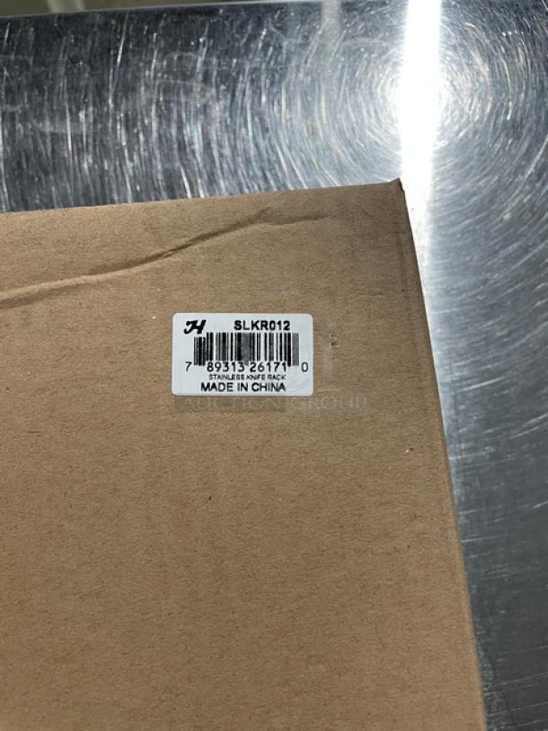 Brand new Thunder Group SLKR012 stainless steel knife rack box with label "Made in China."
