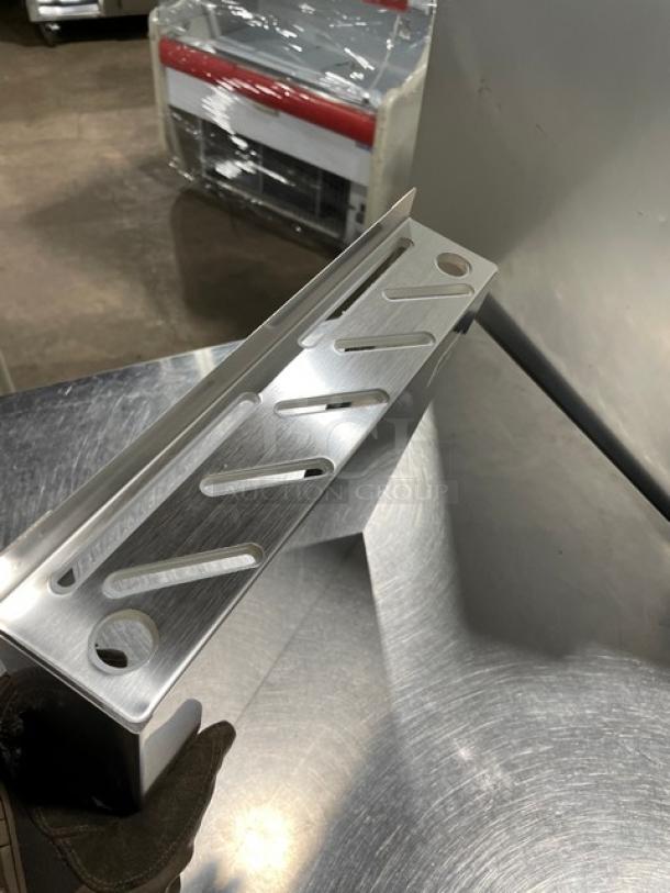 Brand new Thunder Group SLKR012 stainless steel knife rack with slots, commercial-grade.