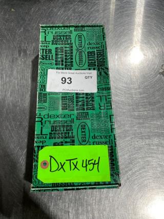 Brand new Dexter Russell Prodex Series stainless steel knife in box with black grip handle; labels indicate auction details.