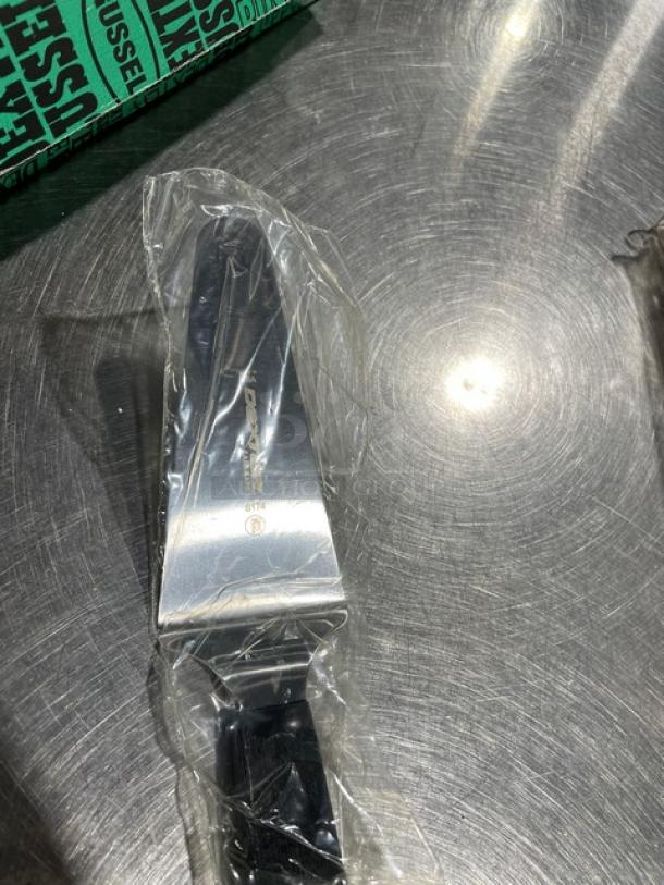 Brand new Dexter Russell Sani-Safe pie knife, model S174, with stainless steel blade and black grip handle, in packaging.