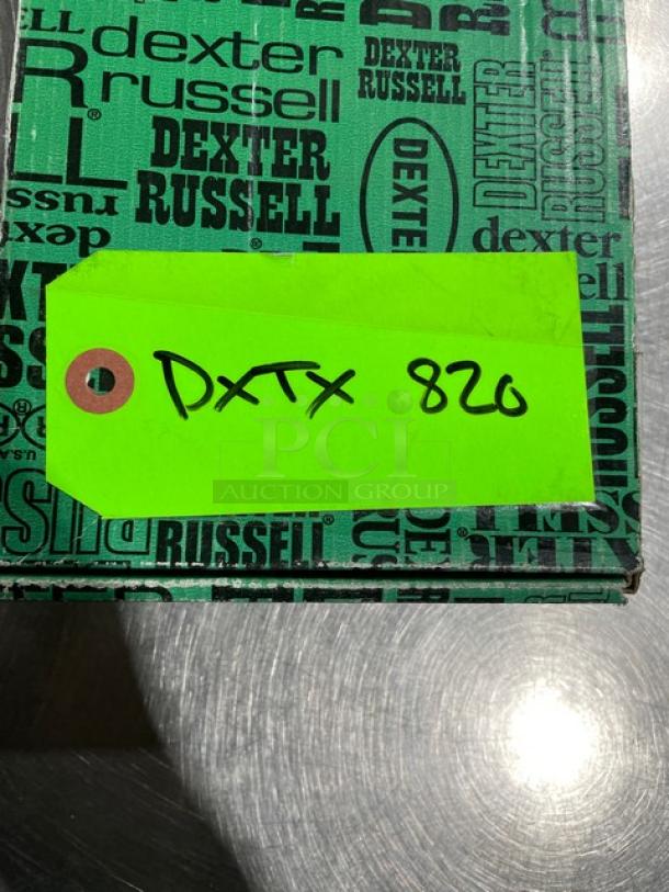 Dexter Russell knife box with branding, green tag labeled "DXTX 820," containing brand new Prodex Series curved boning knife.