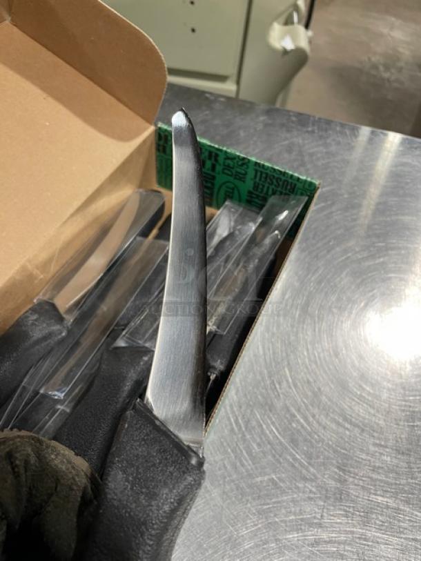 Brand new Dexter Russell Prodex Series boning knife, model PDSH1316ST, with a narrow curved stainless steel blade and black grip handle.
